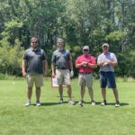 four-men-on-golf-course