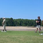 men-playing-golf