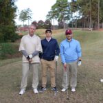 men-smiling-with-golf-clubs