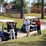 men-getting-in-golf-caddy